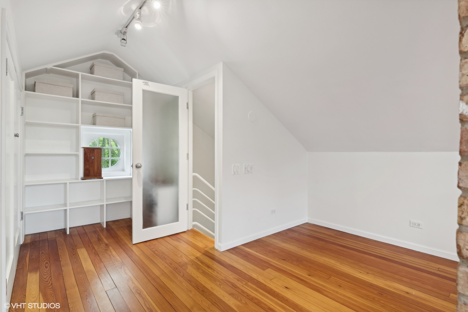 720 Willow Road Winnetka, IL 60093 - Photo 29 of 60 a view of empty room with wooden floor and cabinet