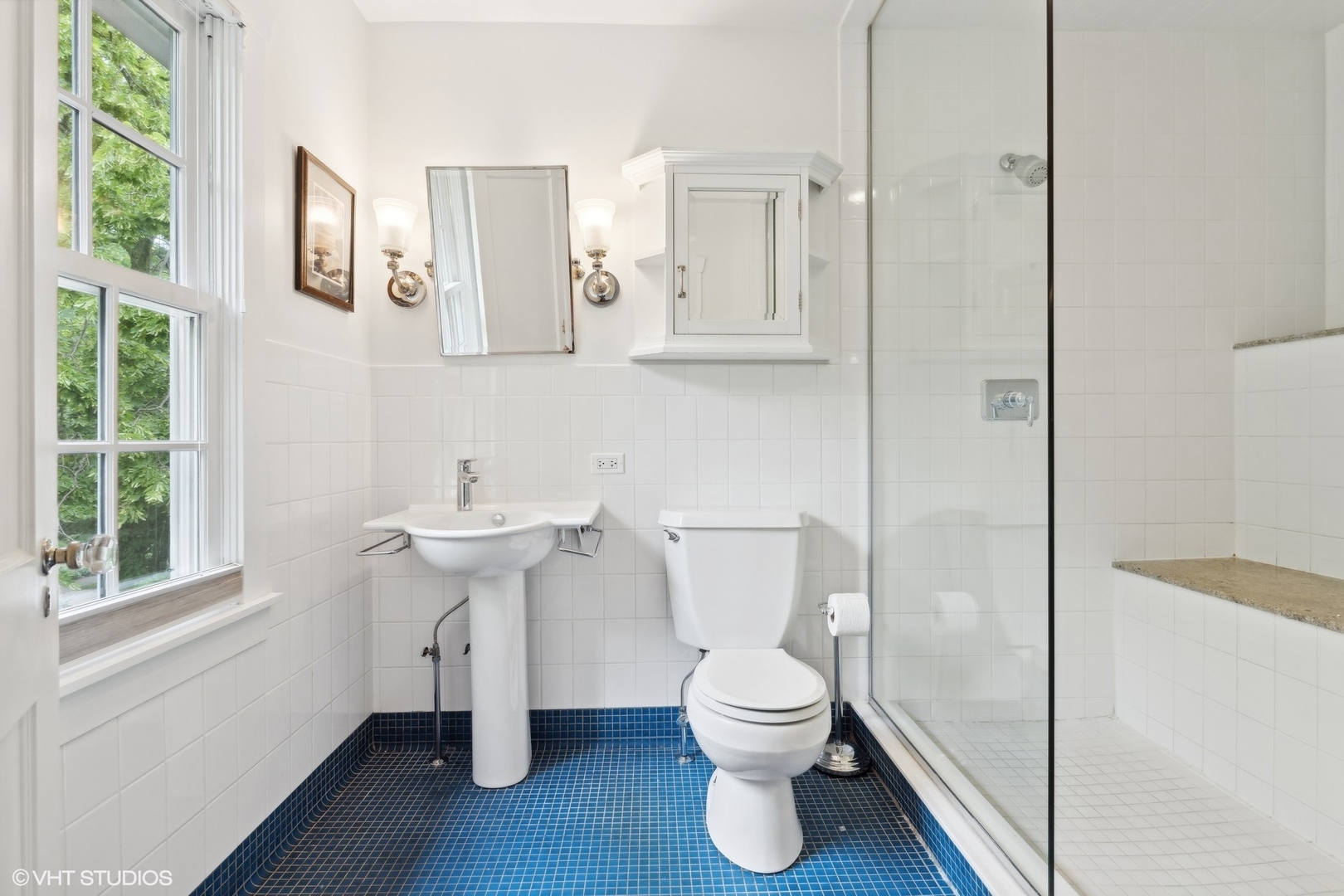 720 Willow Road Winnetka, IL 60093 - Photo 30 of 60 a white toilet sitting next to a bathroom sink