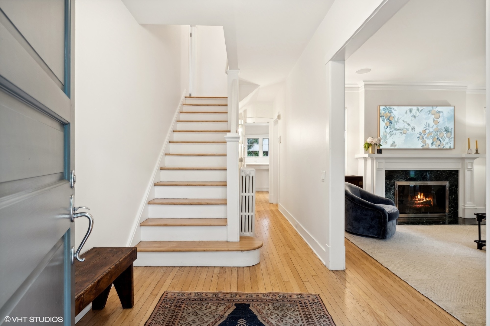 720 Willow Road Winnetka, IL 60093 - Photo 4 of 60 a view of a livingroom with wooden floor and a fireplace