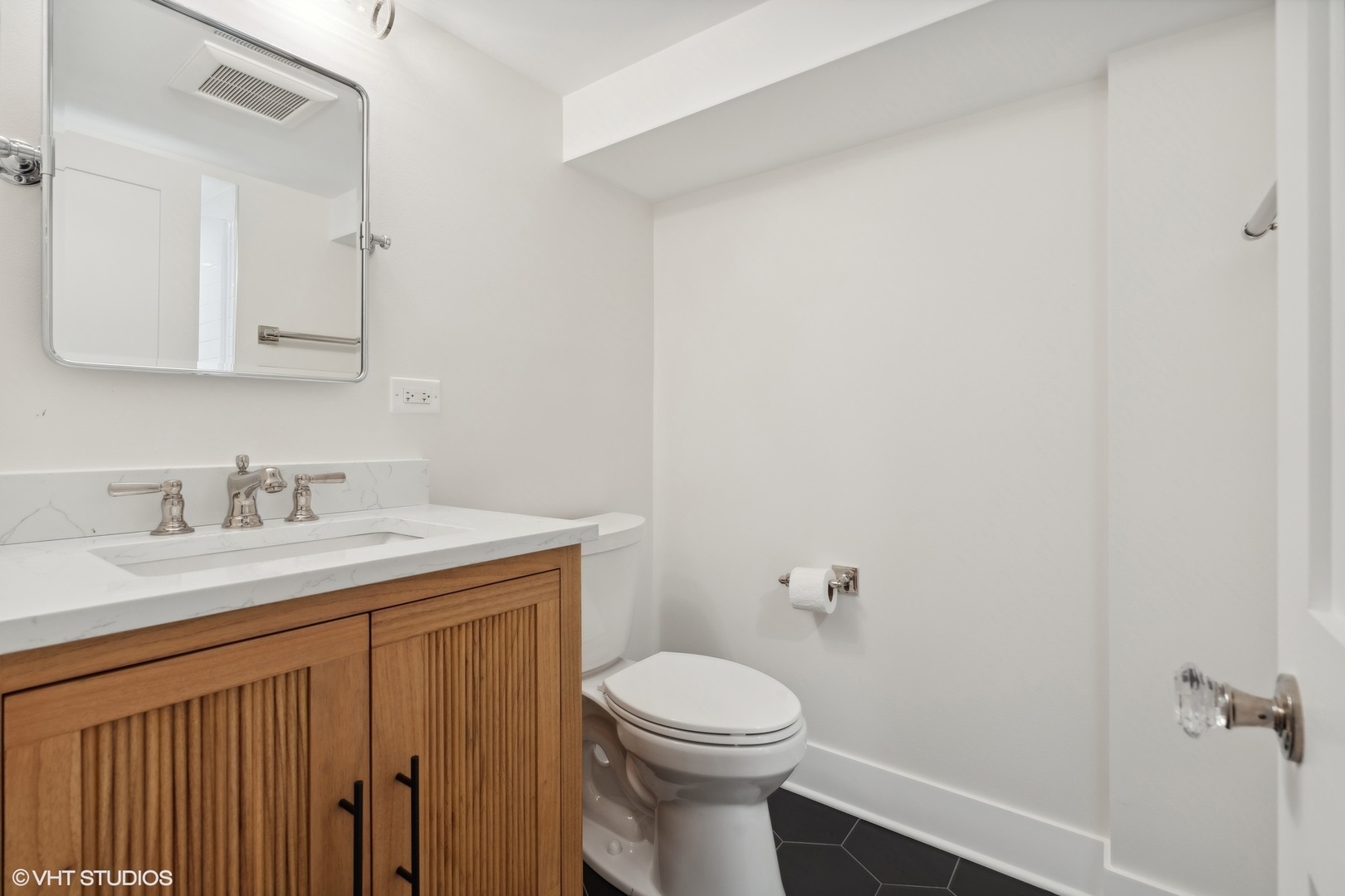 720 Willow Road Winnetka, IL 60093 - Photo 44 of 60 a bathroom with a granite countertop sink toilet and a mirror