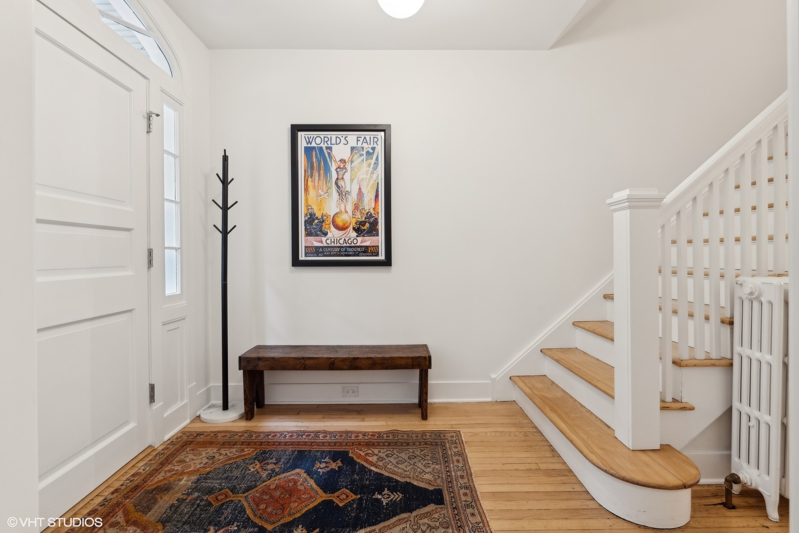 720 Willow Road Winnetka, IL 60093 - Photo 5 of 60 a living room with wooden floor and stairs