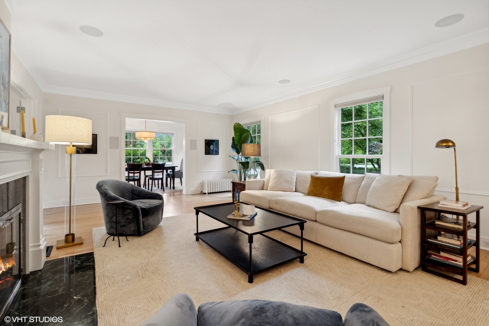 720 Willow Road Winnetka, IL 60093 - Photo 7 of 60 a living room with furniture fireplace and window