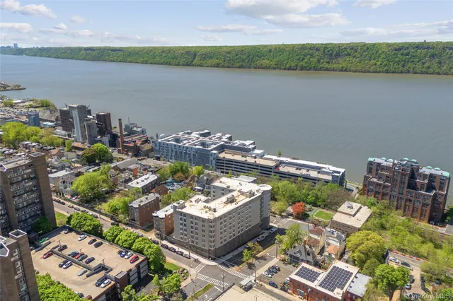 a kitchen with a refrigerator and a sink