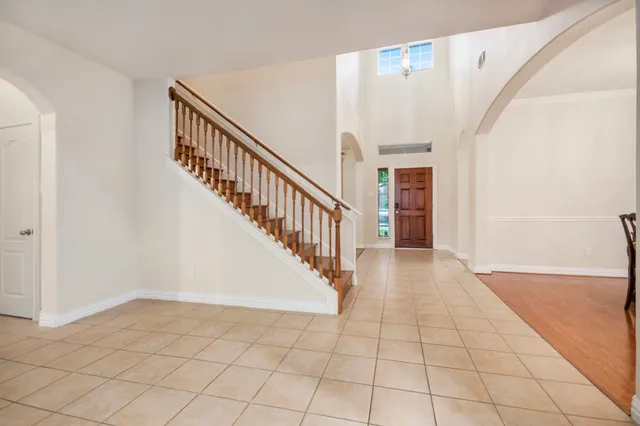a view of an entryway with wooden floor