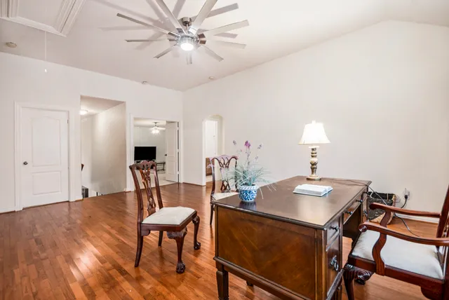 a bedroom with a bed and a chair