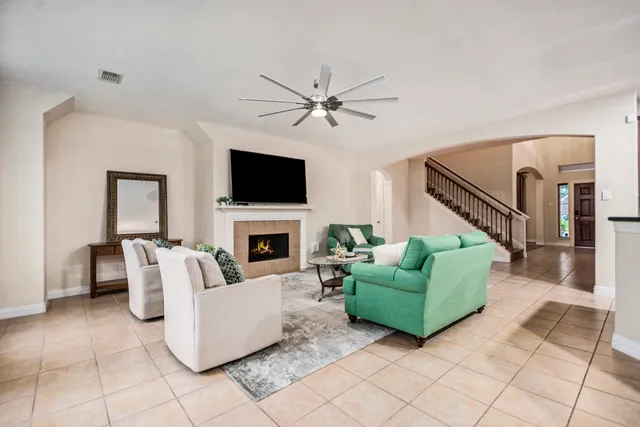 a living room with furniture and a fireplace