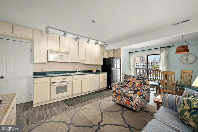 a kitchen with stainless steel appliances a refrigerator and a stove