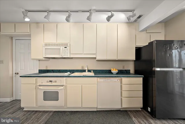 a living room with furniture and flat screen tv