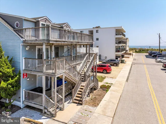 an aerial view of residential houses with outdoor space