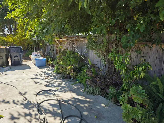 a view of a backyard with a patio