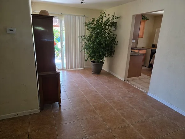 an empty room with an entryway door