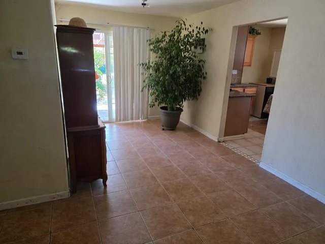 an empty room with an entryway door