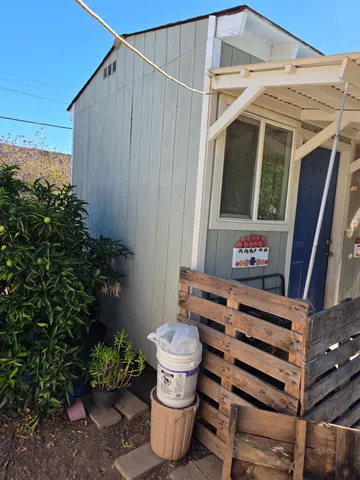 a view of a chairs and table in the patio