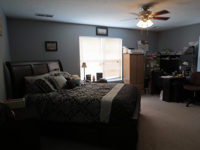 430 Pioneer Road Macon, GA 31217 - Photo 11 of 23 a bed sitting in a bedroom next to a window