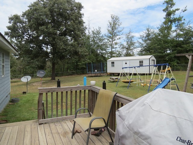 430 Pioneer Road Macon, GA 31217 - Photo 17 of 23 a view of a roof deck with table and chairs wooden floor and fence