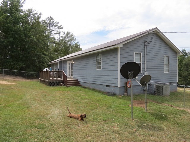 430 Pioneer Road Macon, GA 31217 - Photo 20 of 23 a backyard of a house with table and chairs