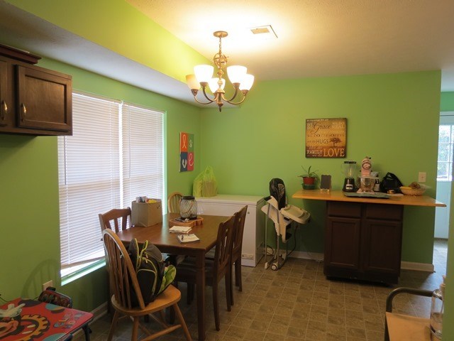 430 Pioneer Road Macon, GA 31217 - Photo 6 of 23 a view of a dining room with furniture and chandelier