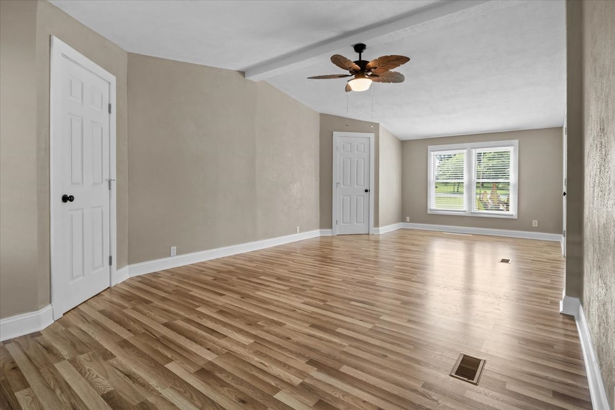 1112 Garners Creek Road Dickson, TN 37055 - Photo 24 of 57 a view of empty room with wooden floor and fan
