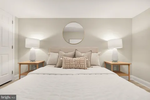 a bedroom with a bed and a couch