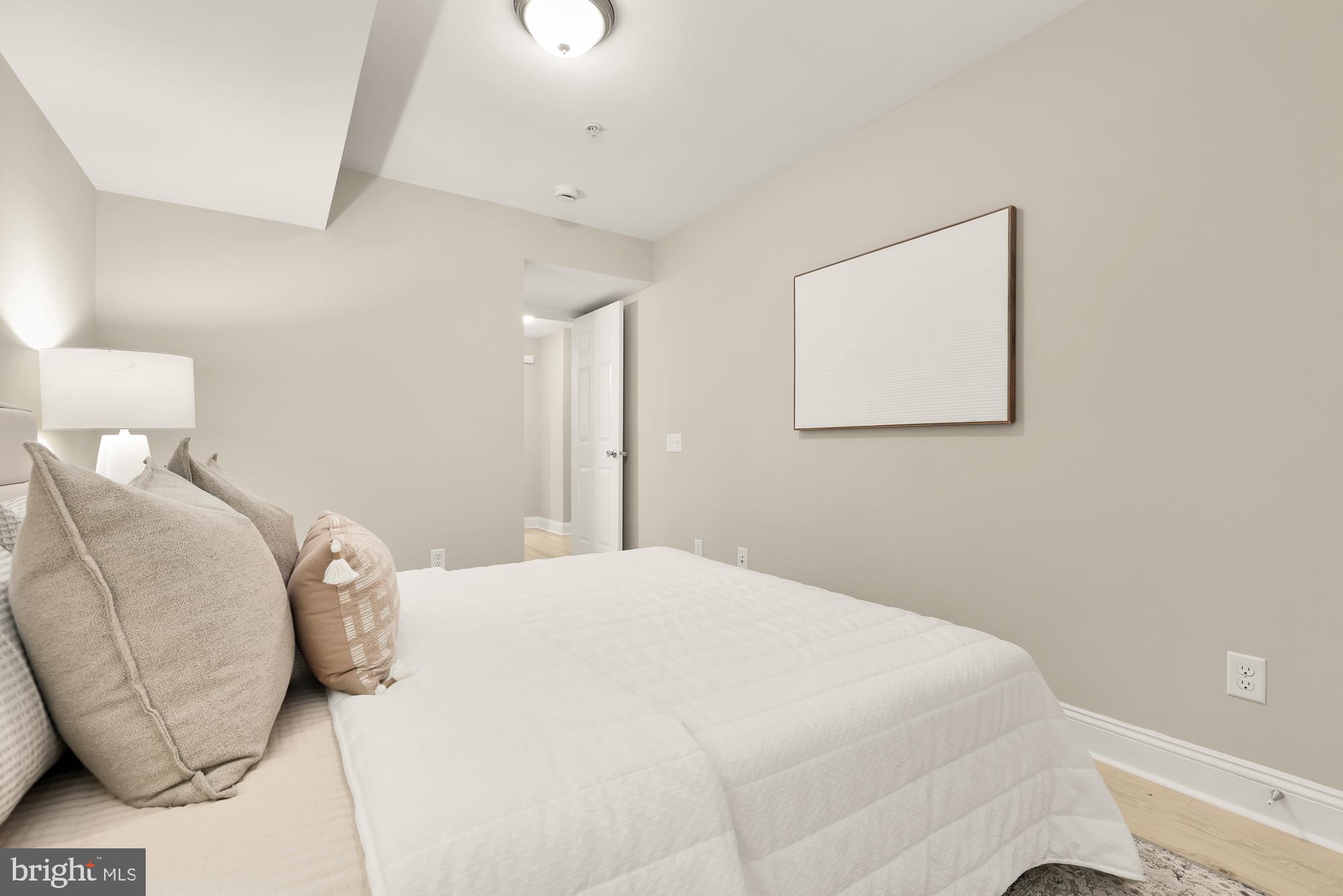 1751 W Street Southeast, Unit B Washington, DC 20020 - Photo 16 of 25 a bedroom with a bed and a couch