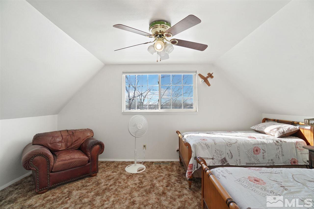 3800 Alcorn Road Fallon, NV 89406 - Photo 13 of 18 a bedroom with a bed couch and window