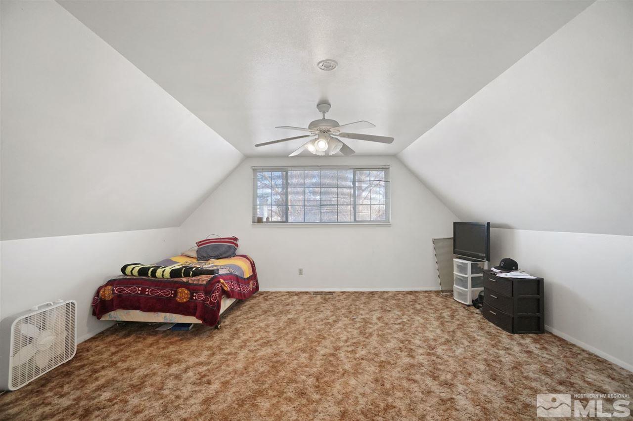3800 Alcorn Road Fallon, NV 89406 - Photo 14 of 18 a bedroom with a bed and a tv on the dresser