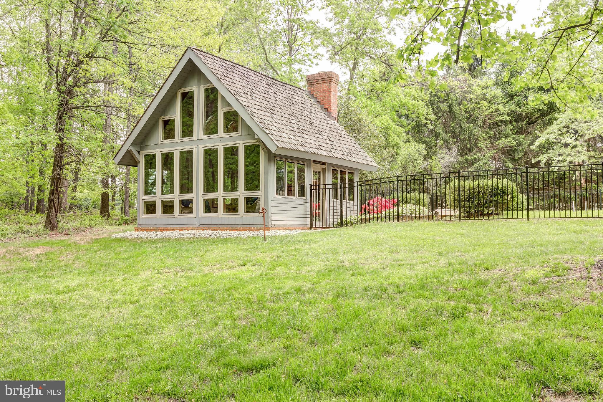 2219 Tufton Ridge Road Reisterstown, MD 21136 - Photo 22 of 27 a front view of a house with a yard