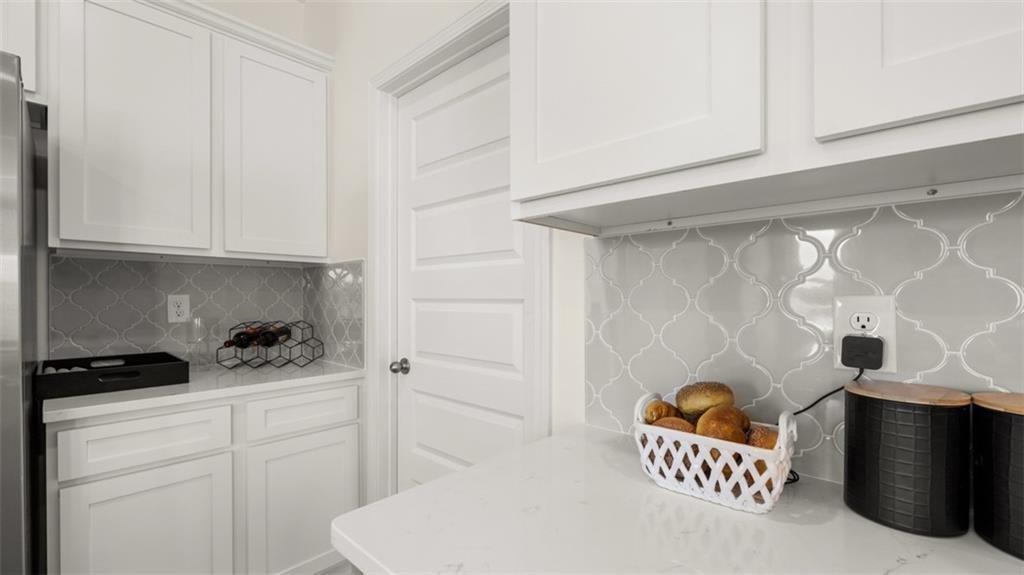 11933 Aukerman Way Hampton, GA 30228 - Photo 13 of 42 a kitchen with stainless steel appliances cabinets and a window