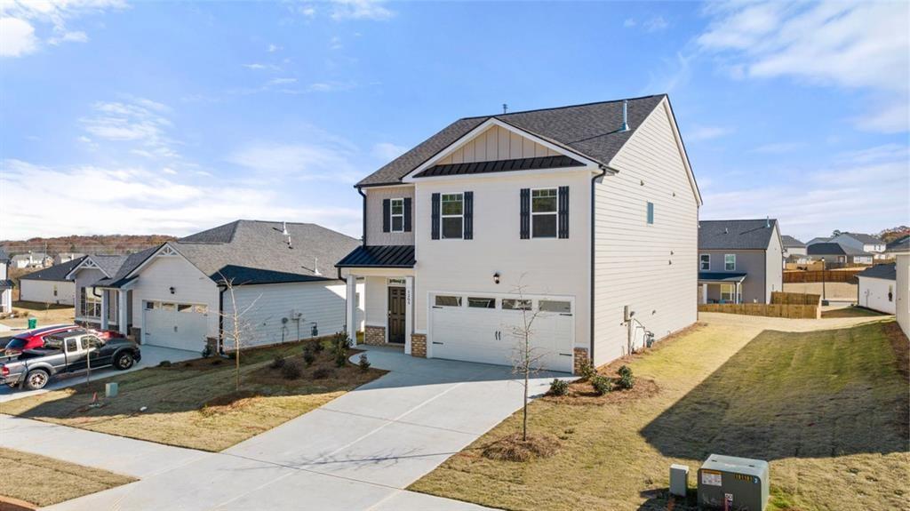 11933 Aukerman Way Hampton, GA 30228 - Photo 3 of 42 a front view of a house with a yard
