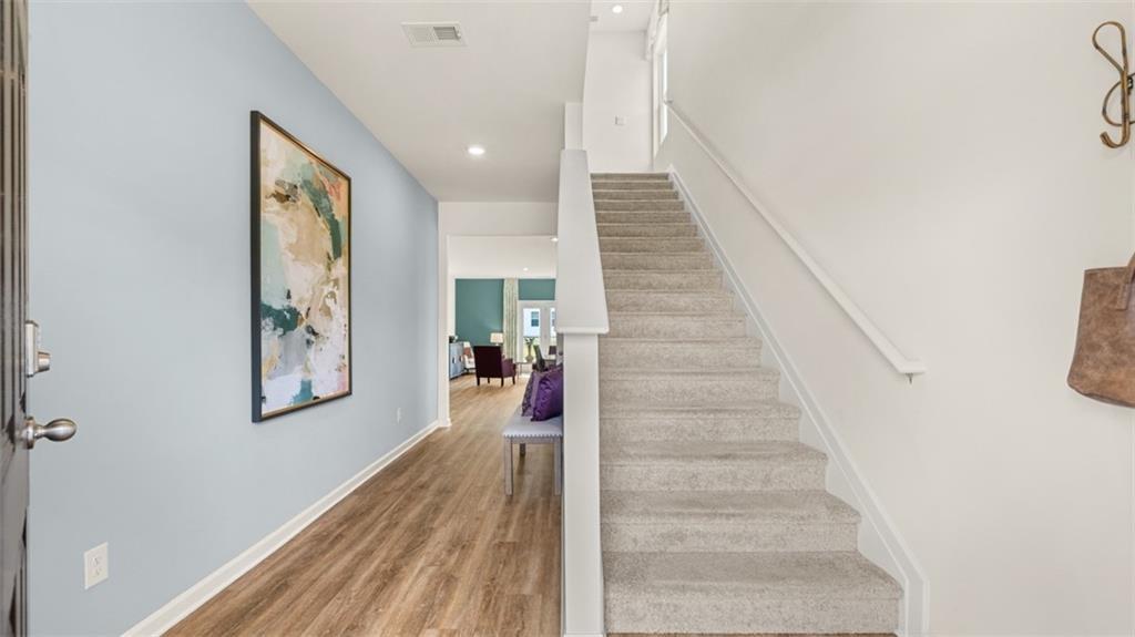 11933 Aukerman Way Hampton, GA 30228 - Photo 6 of 42 a view of entryway and hall with wooden floor