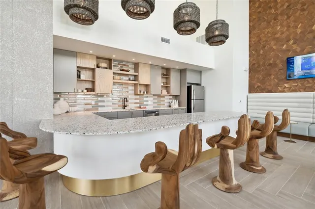 a kitchen with a dining table and chairs