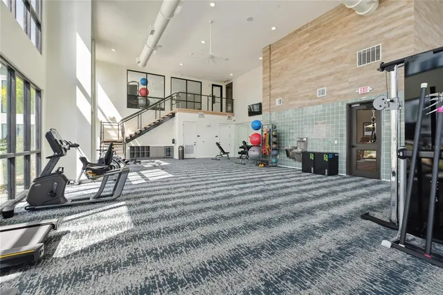 a view of a hallway with a table and chairs