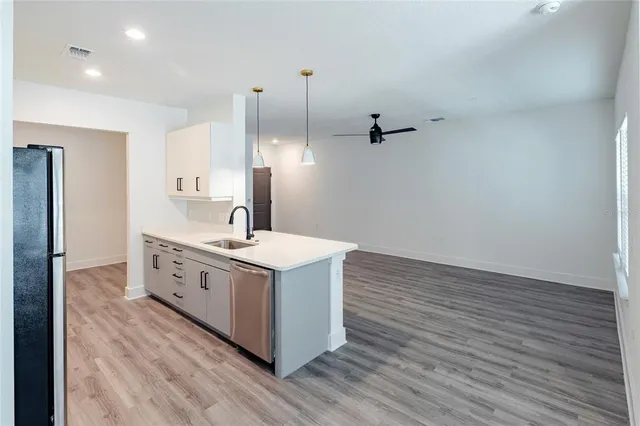 a kitchen with a sink and cabinets