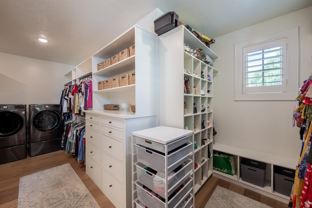 630 East Center Street Alpine, UT 84004 - Photo 45 of 115 Custom closet organization system featuring white cabinetry, built-in drawers with black hardware, and open shelving
