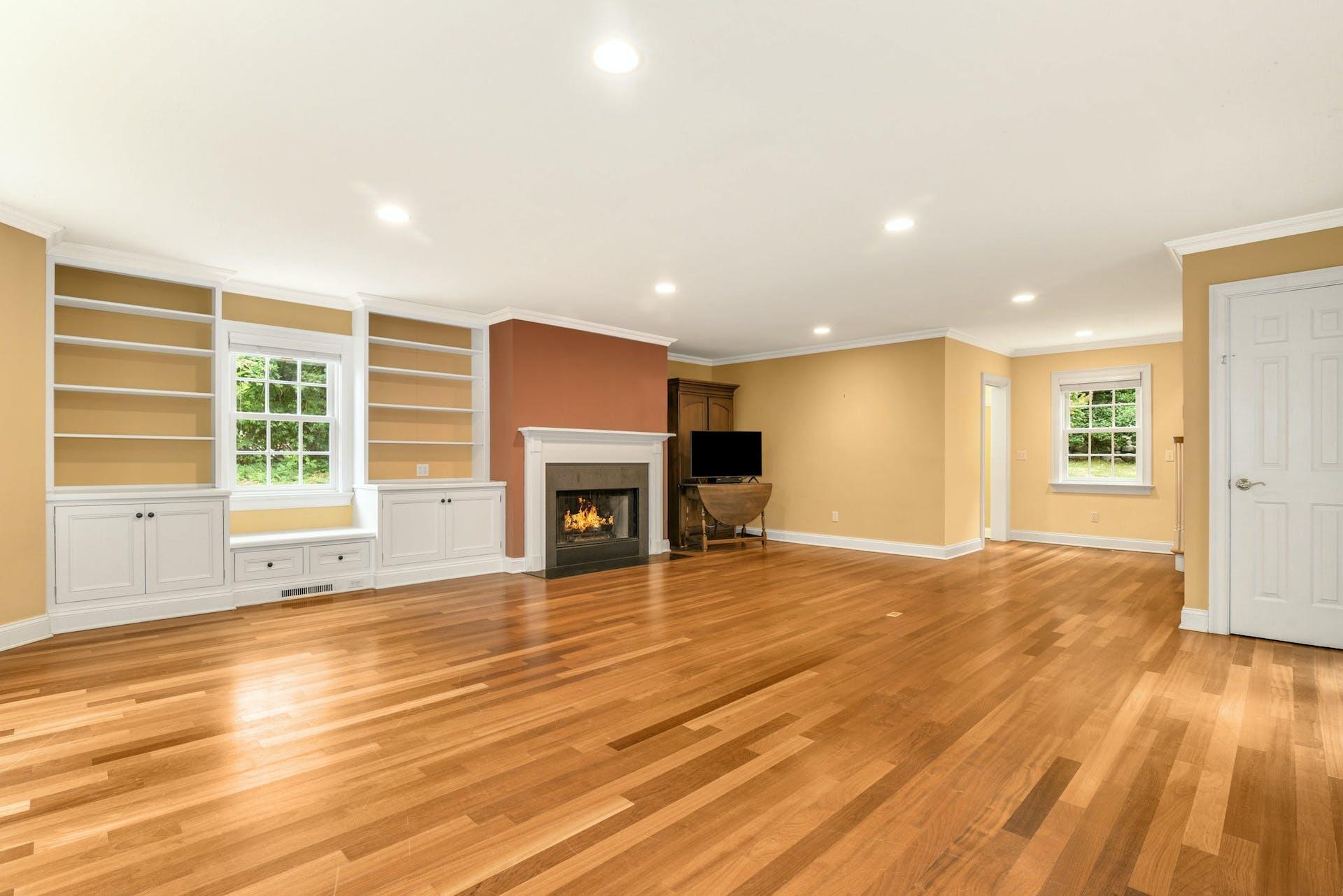 15 Briar Brae Road Darien, CT 06820 - Photo 12 of 32 a view of empty room with wooden floor and fireplace