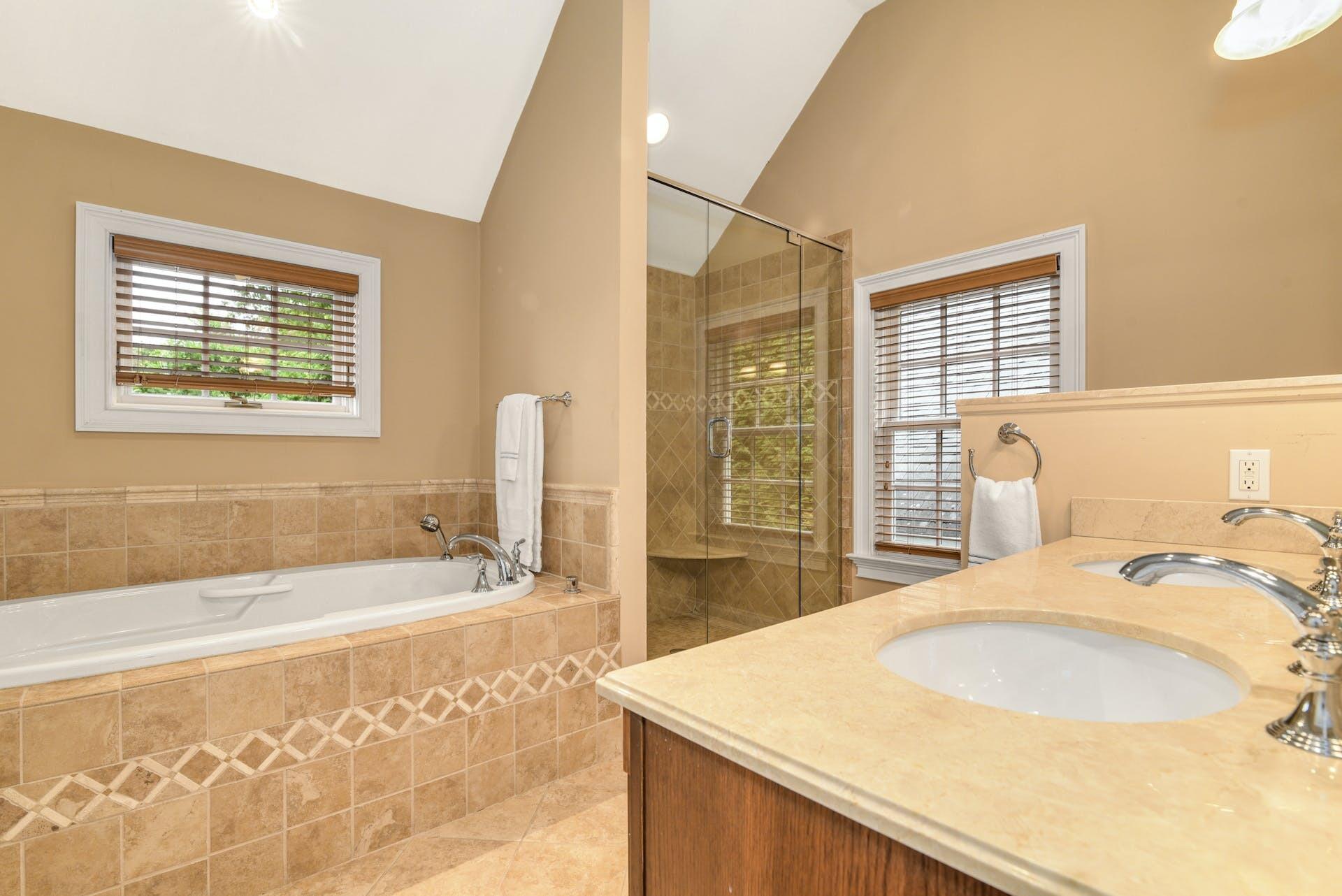 15 Briar Brae Road Darien, CT 06820 - Photo 20 of 32 a bathroom with a granite countertop sink and a bathtub