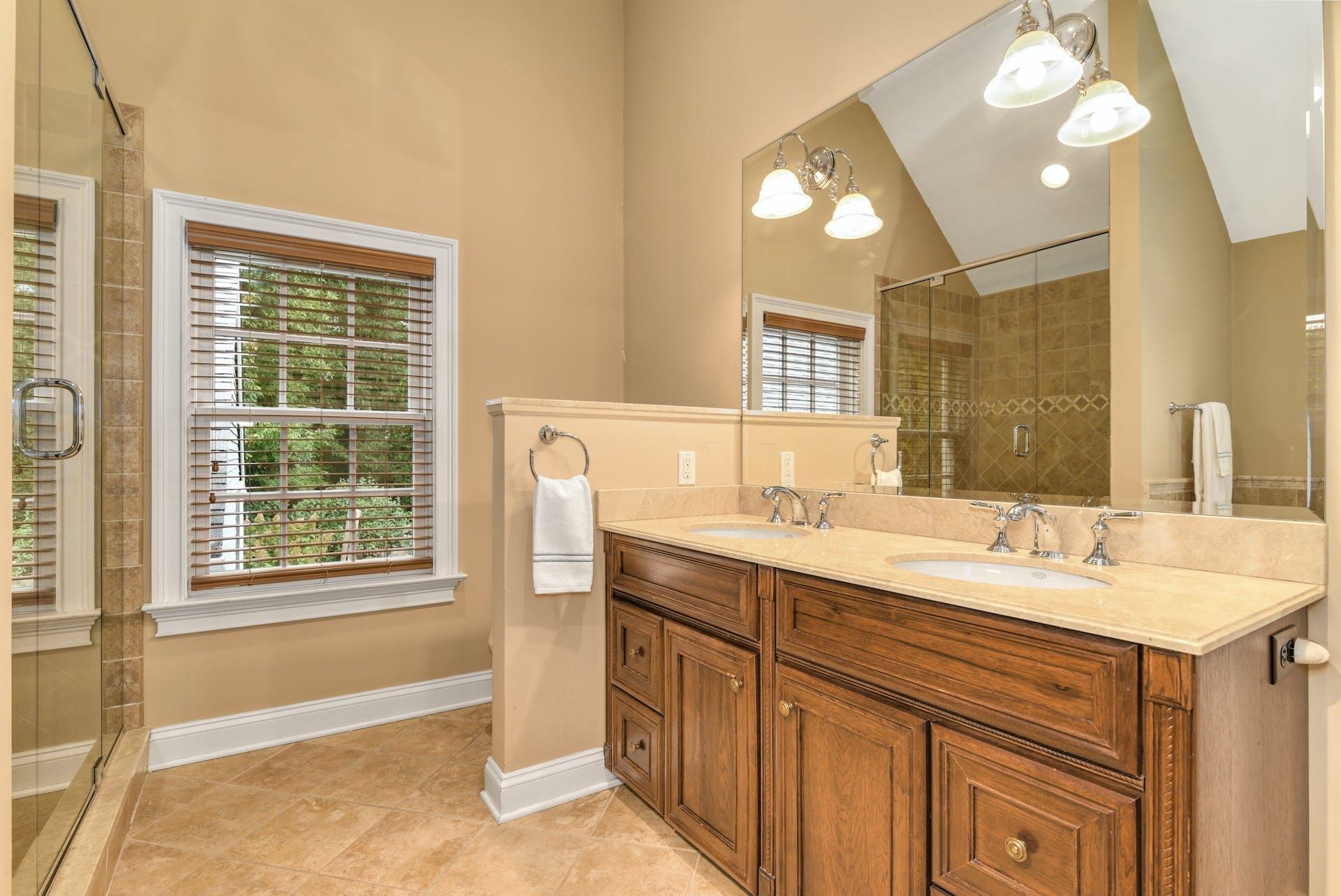 15 Briar Brae Road Darien, CT 06820 - Photo 21 of 32 a bathroom with a sink double vanity and a mirror