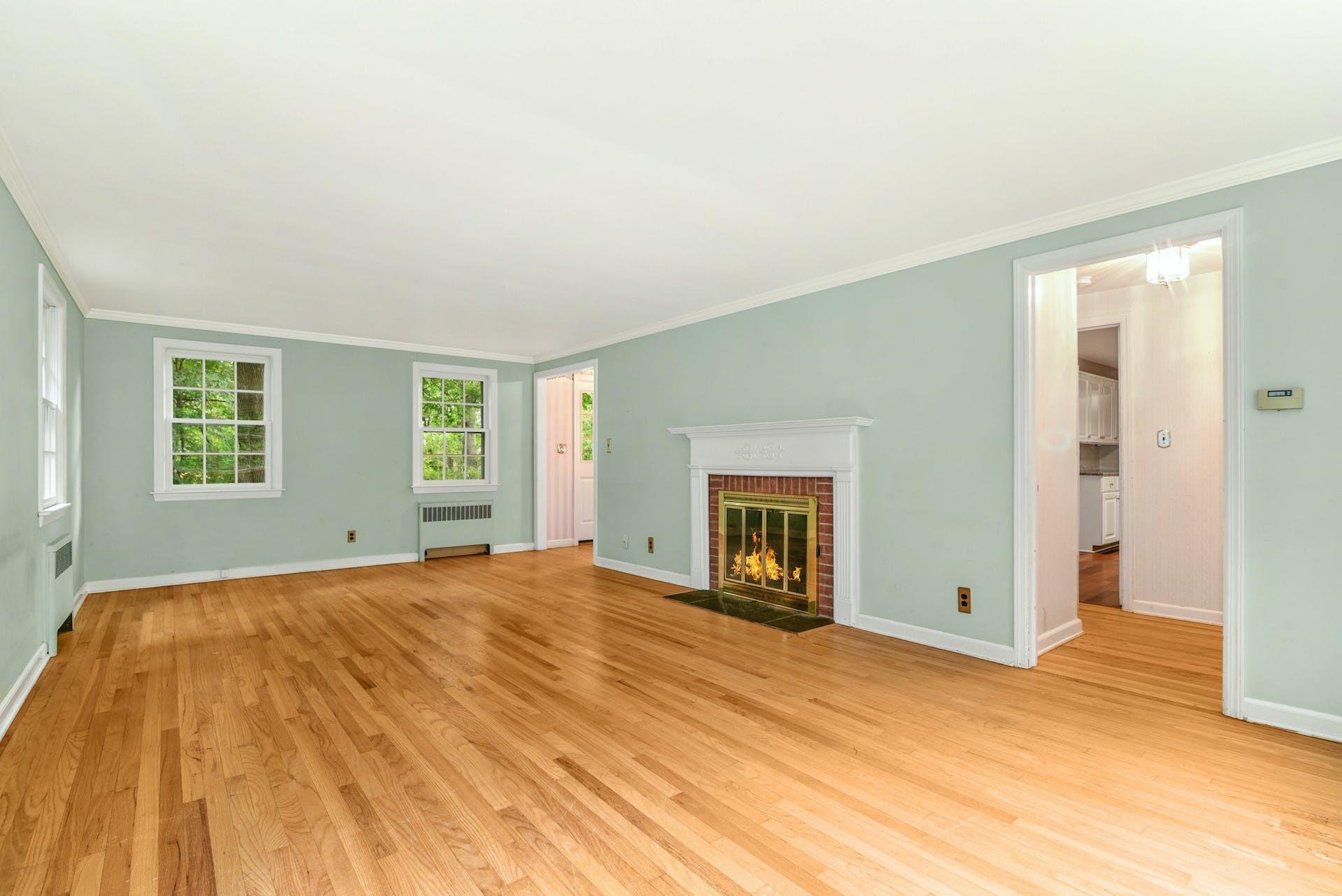 15 Briar Brae Road Darien, CT 06820 - Photo 3 of 32 a view of empty room with a fireplace and wooden floor
