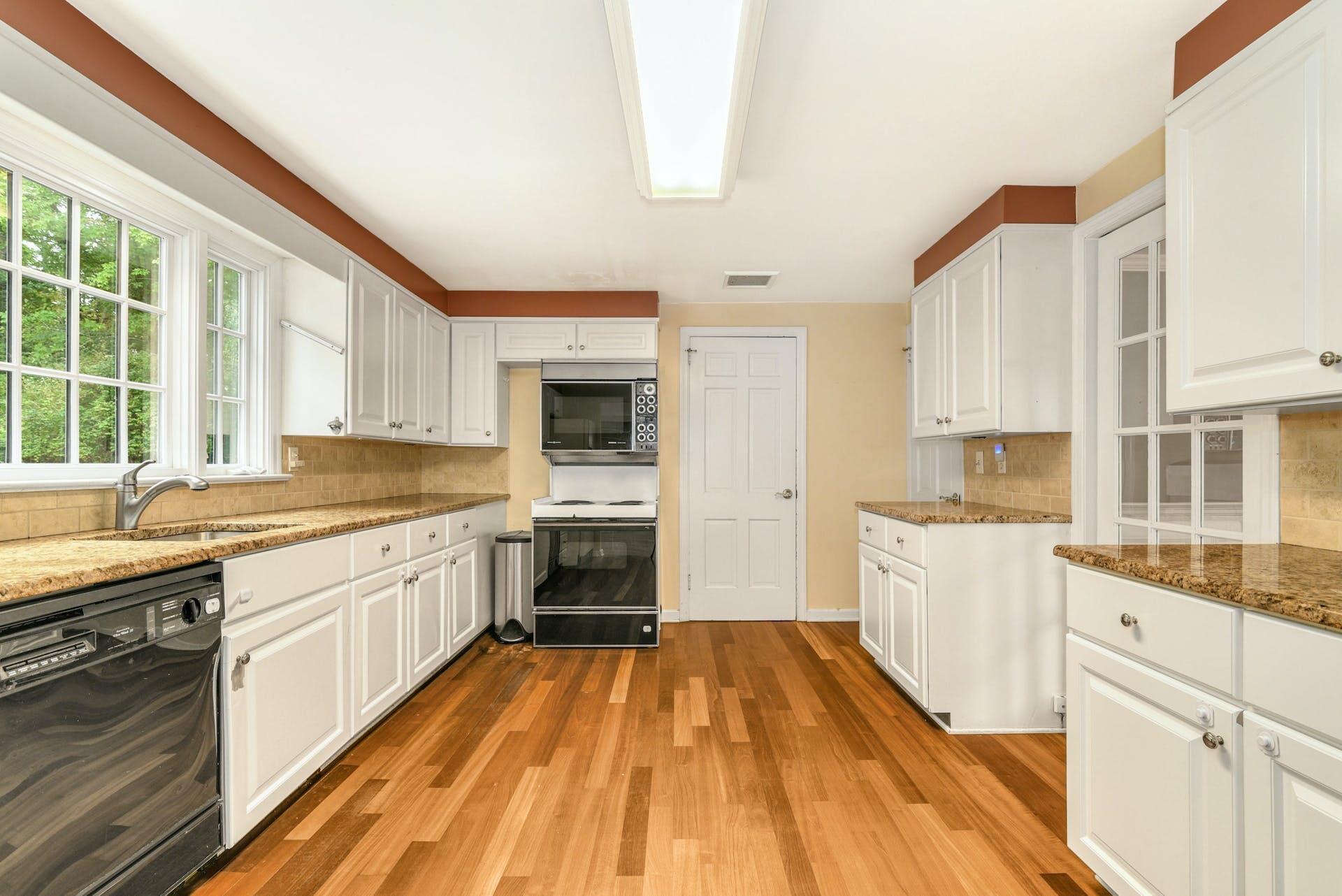 15 Briar Brae Road Darien, CT 06820 - Photo 10 of 32 a kitchen with granite countertop a sink and a stove top oven