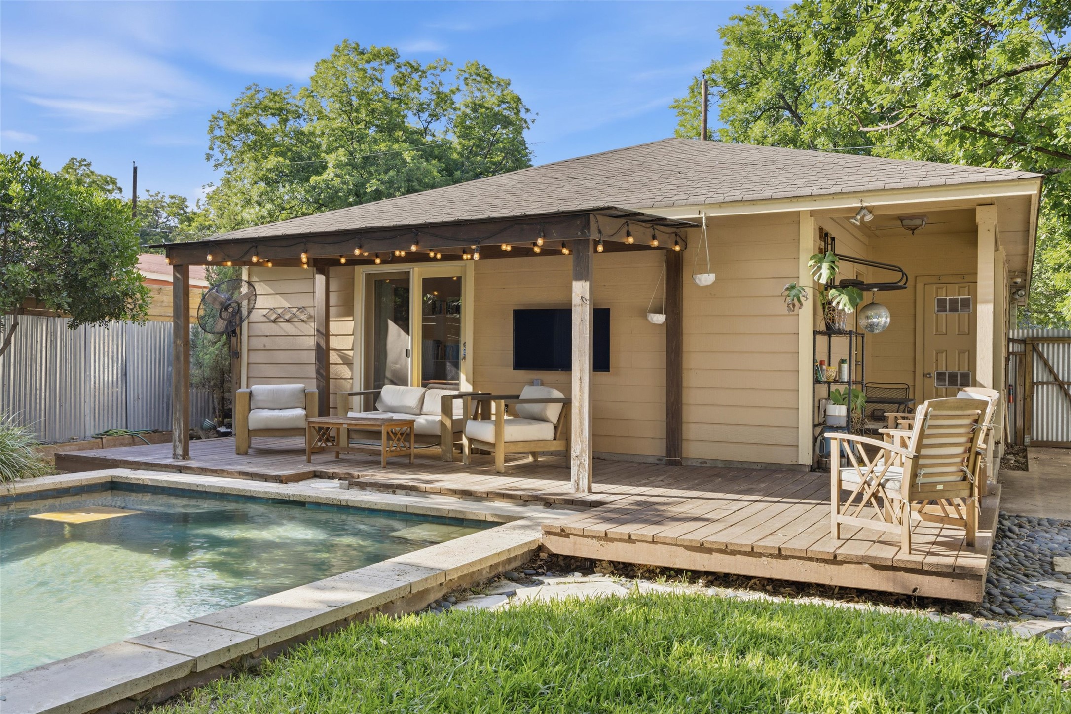 3015 Castro Street Austin, TX 78702 - Photo 35 of 40 A private deck with a sparkling pool creates an inviting outdoor entertainment area.