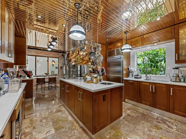 a kitchen with stainless steel appliances granite countertop a sink and cabinets