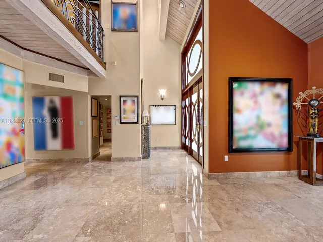 a view of a hallway with a refrigerator