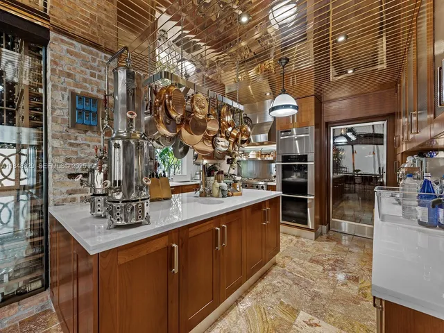 a kitchen with stainless steel appliances granite countertop a sink and cabinets