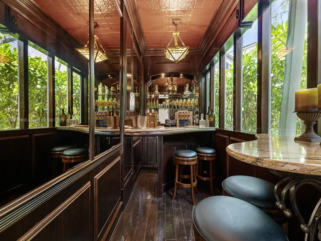 a room with wooden floor and furniture