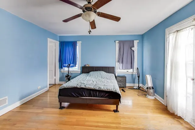 a bedroom with a bed and window
