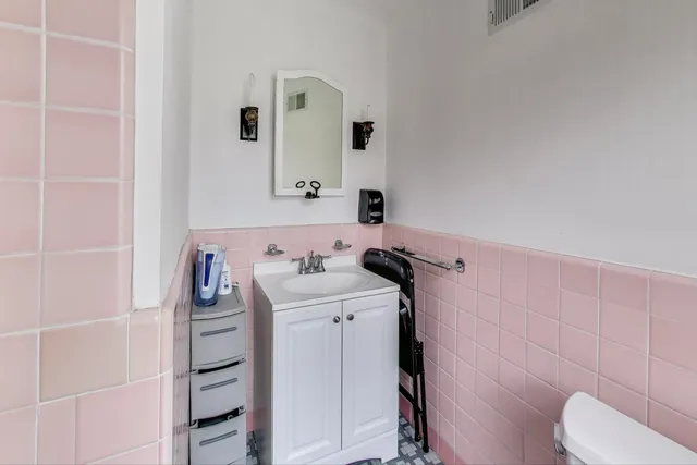 a bathroom with a sink and toilet