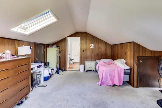 a bedroom with a bed and a closet