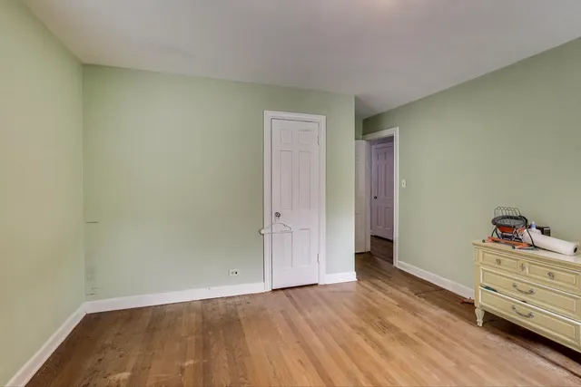 an empty room with cabinet and closet