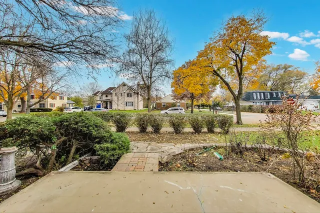a view of a street with a building in the background