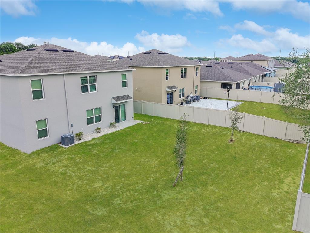 2085 Doe Run Drive Davenport, FL 33837 - Photo 4 of 44 a view of a house with a yard and sitting area